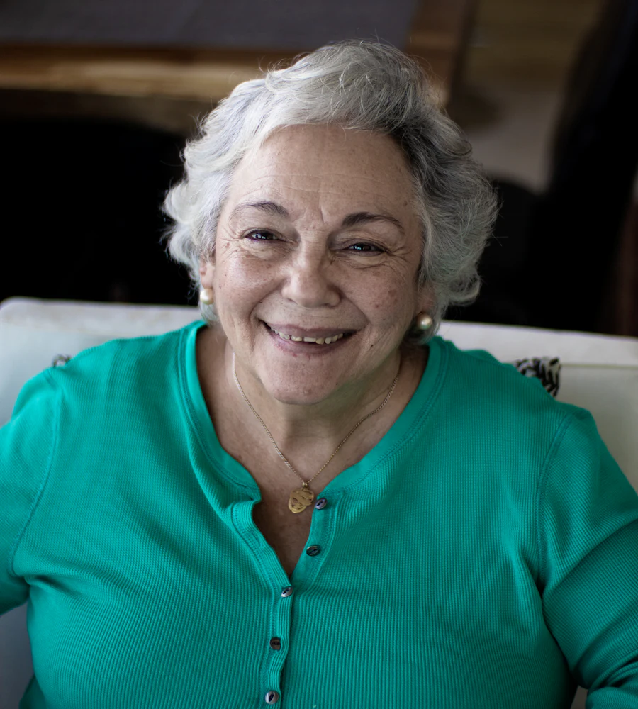 An older woman smiling at home